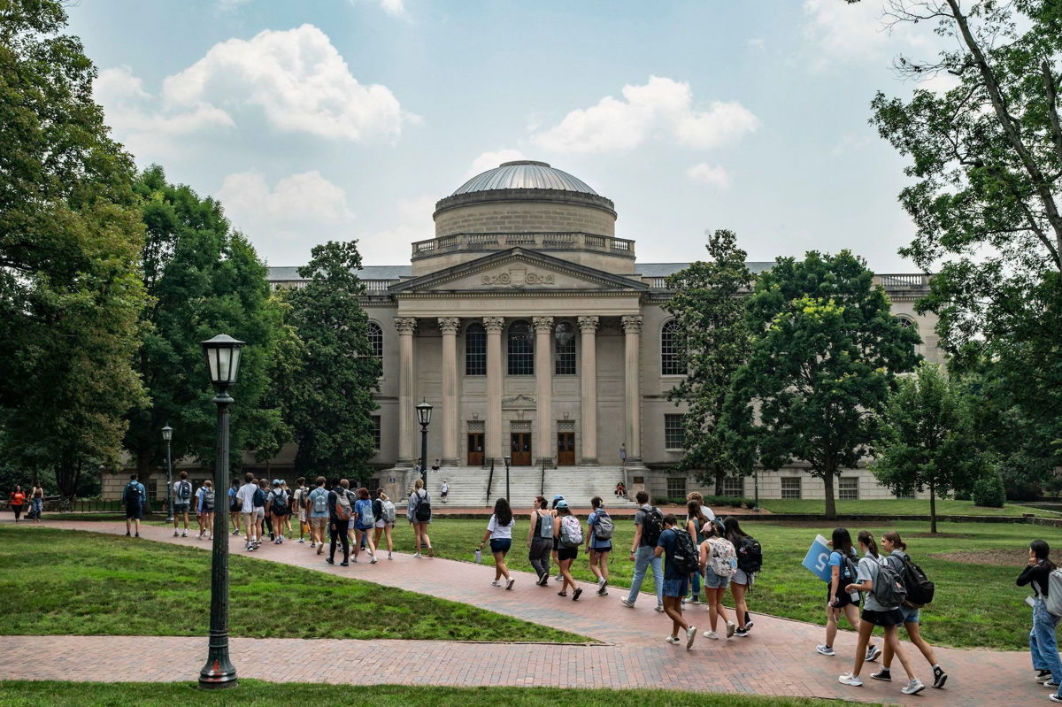 <i>Eros Hoagland/Getty Images via CNN Newsource</i><br/>People walk on the campus of the University of North Carolina Chapel Hill in June 2023 in Chapel Hill