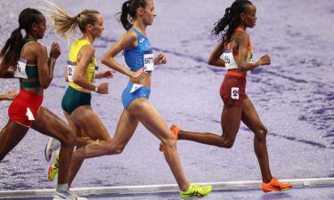 Kenya's Beatrice Chebet leads ahead of Italy's Nadia Battocletti in the women's 10000m final of the athletics event at the Paris 2024 Olympic Games at Stade de France in Saint-Denis