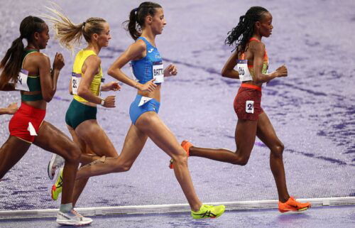 Kenya's Beatrice Chebet leads ahead of Italy's Nadia Battocletti in the women's 10000m final of the athletics event at the Paris 2024 Olympic Games at Stade de France in Saint-Denis