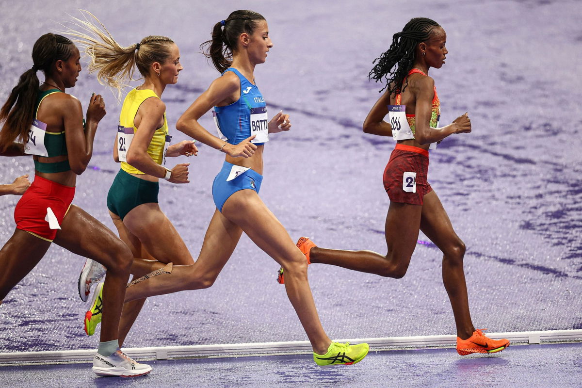 <i>Anne-Christine Poujoulat/AFP/Getty Images via CNN Newsource</i><br/>Kenya's Beatrice Chebet leads ahead of Italy's Nadia Battocletti in the women's 10000m final of the athletics event at the Paris 2024 Olympic Games at Stade de France in Saint-Denis