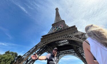 Police evacuate the area around the Eiffel Tower after a man was seen climbing the historic landmark