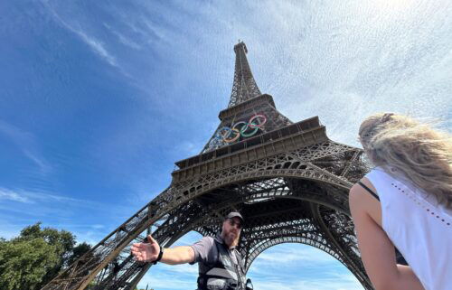 Police evacuate the area around the Eiffel Tower after a man was seen climbing the historic landmark