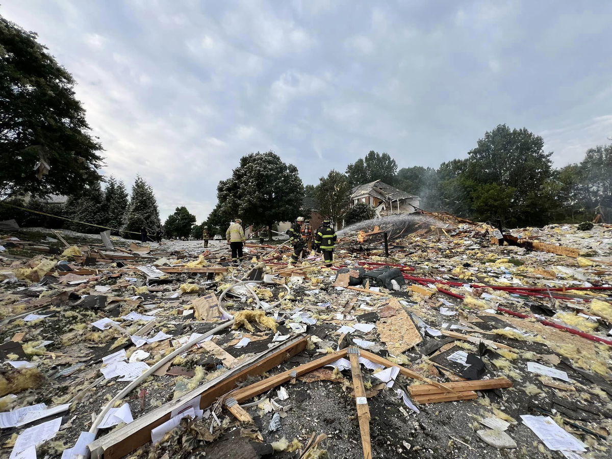 <i>Harford County Executive Bob Cassilly via CNN Newsource</i><br/>First responders walk through debris in the aftermath of a home explosion in Harford County