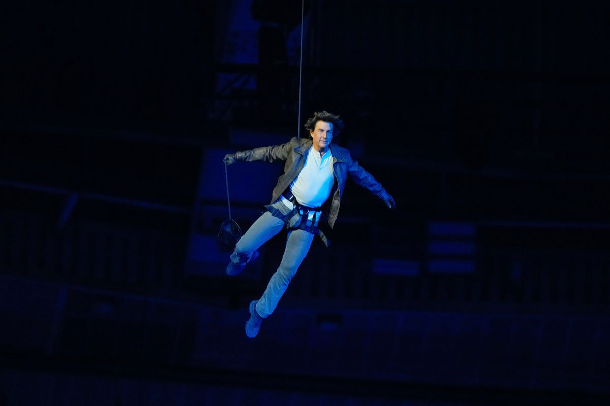 <i>Natacha Pisarenko/AP via CNN Newsource</i><br/>Tom Cruise is lowered on the State de France during the 2024 Summer Olympics closing ceremony on Aug. 11