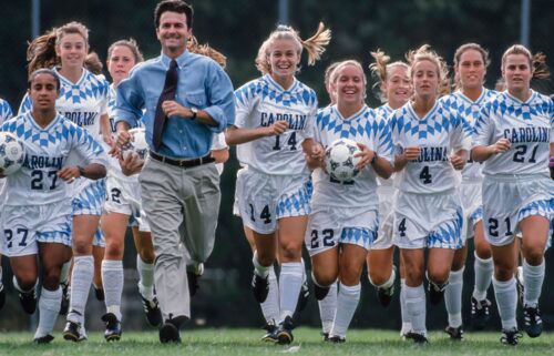 Dorrance runs with the team while training on September 24