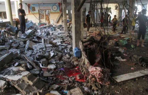 Palestinians inspect the damage after an Israeli strike on a school in Gaza City on Saturday.