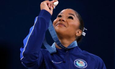 American gymnast Jordan Chiles looks at her bronze medal after the floor event on August 5.