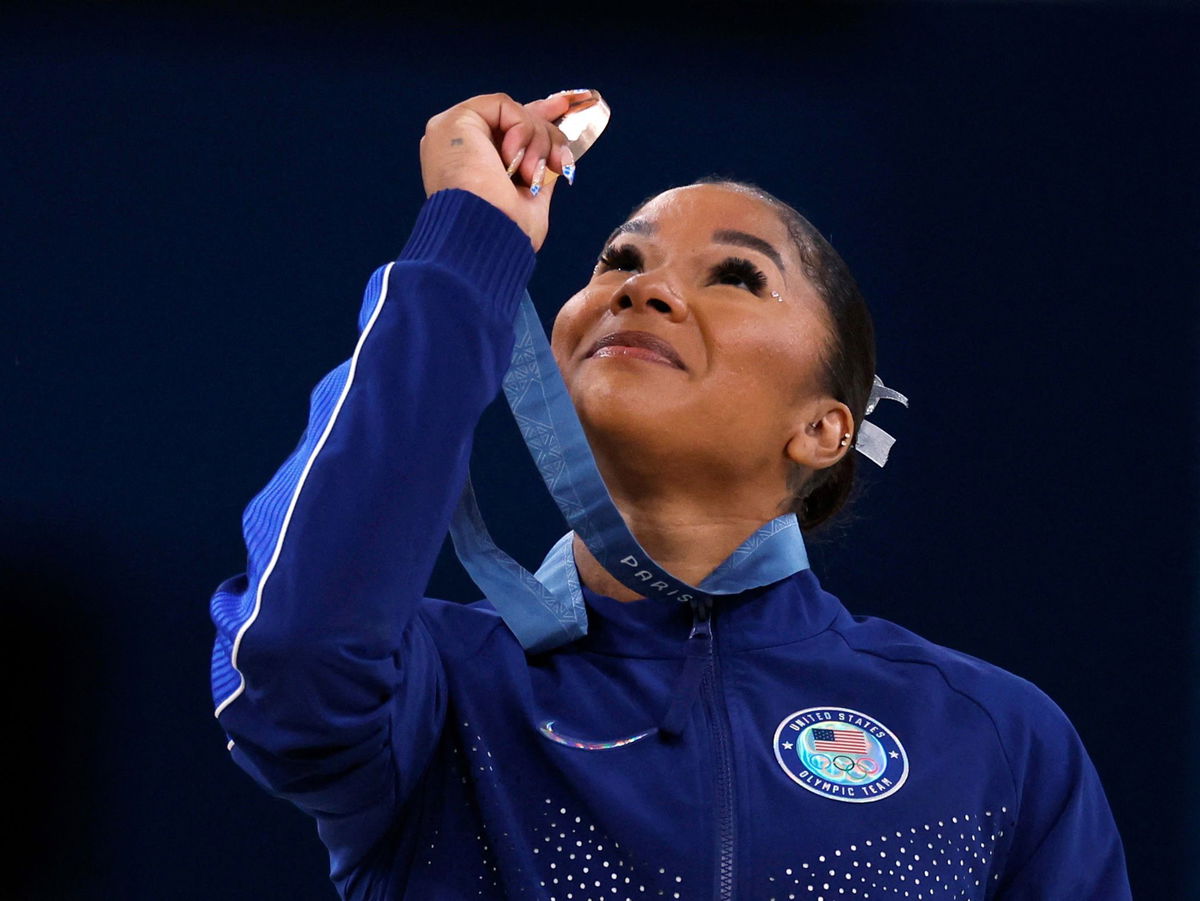 <i>Amanda Perobelli/Reuters via CNN Newsource</i><br/>American gymnast Jordan Chiles looks at her bronze medal after the floor event on August 5.