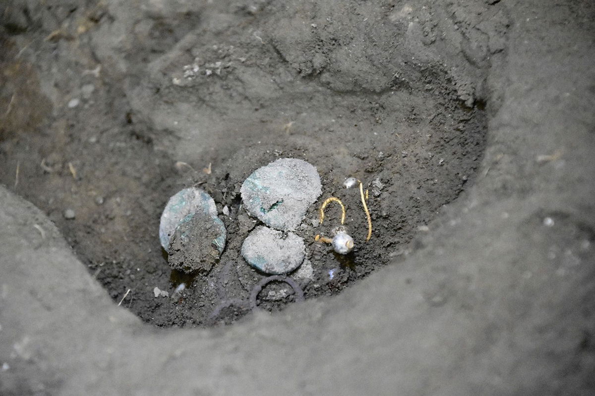 <i>Archeological Park of Pompeii via CNN Newsource</i><br/>The woman was found holding coins and jewelry.