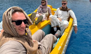 Content creator Ben Herskowitz and friends enjoying a pedal boat excursion on a lake in Band-e-Amir national park.