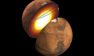 An artist's concept shows a cutaway of Mars along with the paths of seismic waves from two separate quakes detected by InSight in 2021.