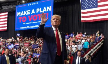 Republican presidential nominee former President Donald Trump gestures after speaking at a campaign rally in Bozeman