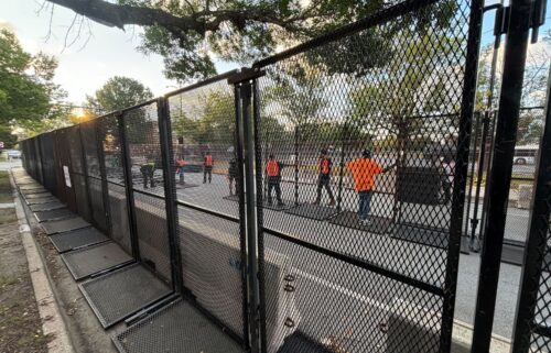 Chicago workers set up the additional line of security fences outside the United Center on August 20.