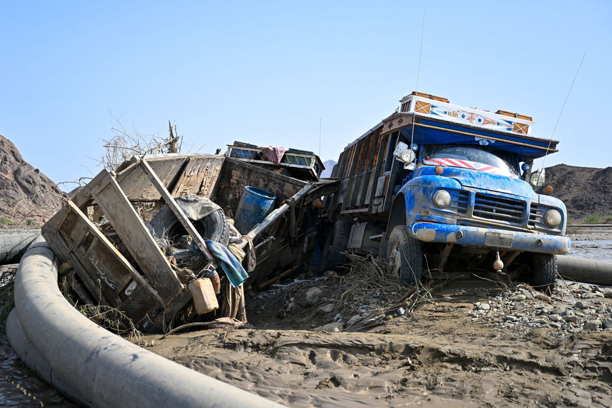 <i>AFP/Getty Images via CNN Newsource</i><br/>Damaged trucks buried in the mud after the collapse of the Arba'at Dam in Sudan following heavy rains and torrential floods on August 25