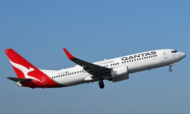 A Qantas plane departs Melbourne Airport on July 31