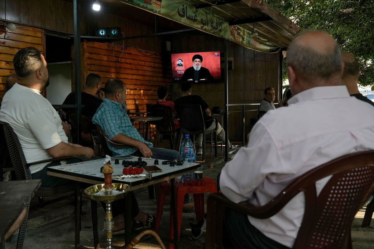 <i>Bilal Hussein/AP via CNN Newsource</i><br/>People watch a televised speech by Hezbollah leader Hassan Nasrallah at a coffee shop in a southern suburb of Beirut on August 25