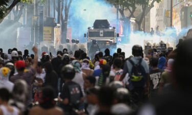 Demonstrators clash with police during a protest against President Nicolas Maduro in Caracas