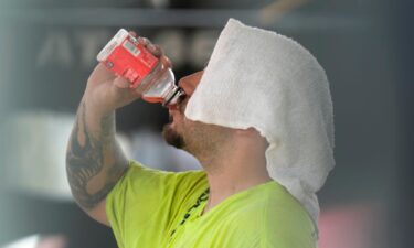 A construction worker hydrates at the Shedd Aquarium Tuesday