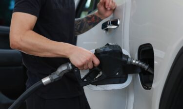 A customer gets gas at a Shell station on May 15