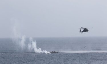 A rigid inflatable boat (RIB) from the Arleigh Burke-class guided-missile destroyer USS Daniel Inouye (DDG 118) and a search and rescue (SAR) helicopter from USS Theodore Roosevelt (CVN 71) successfully recovered two mariners from the water.