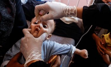 A child is vaccinated against polio in Khan Younis.