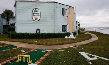 Siding hangs from building in November 2022 at The Reef Ocean Resort in Vero Beach