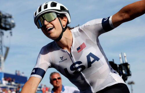 Kristen Faulkner of the United States celebrates at the finish line as gold medal winner during the women's road race on day nine of the Paris Olympics at the Trocadero on August 04