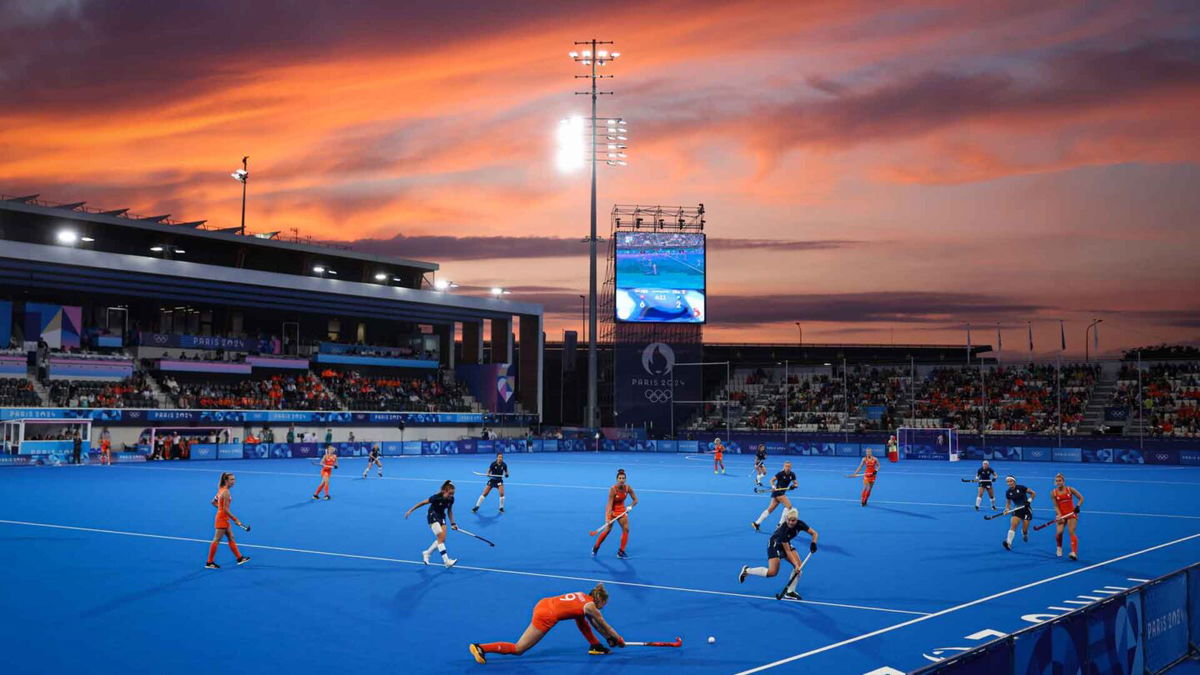 A general view as the sun sets during play in the women's Pool A match between the Netherlands and France on day one of the Paris Olympics at Stade Yves Du Manoir on July 27