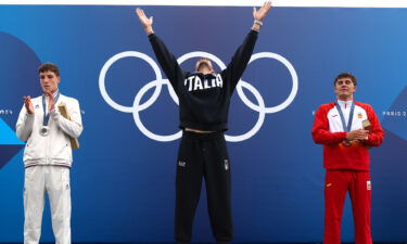 Gold medalist Giovanni de Gennaro of Team Italy celebrates on the podium during the Canoe Slalom Men's Kayak Single medal ceremony after the the Canoe Slalom Men's Kayak Single Final.