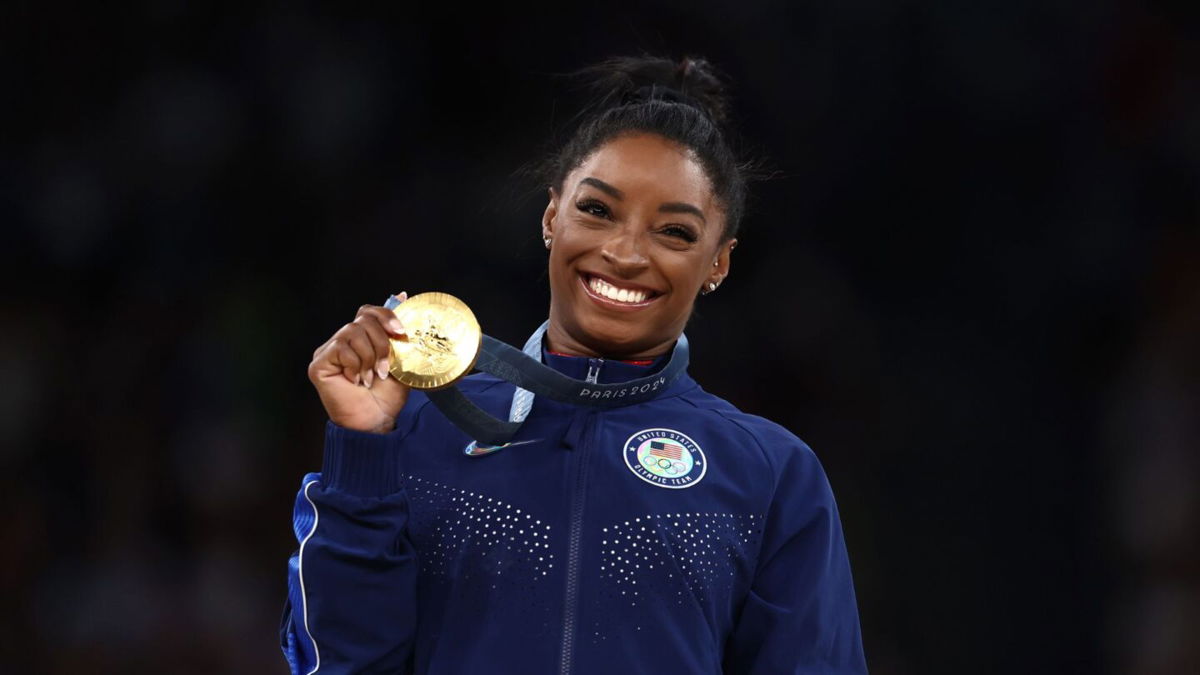 Simone Biles celebrates gold