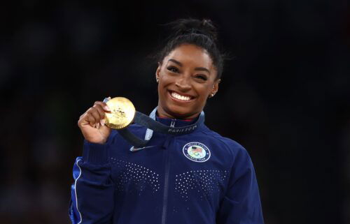 Simone Biles celebrates gold