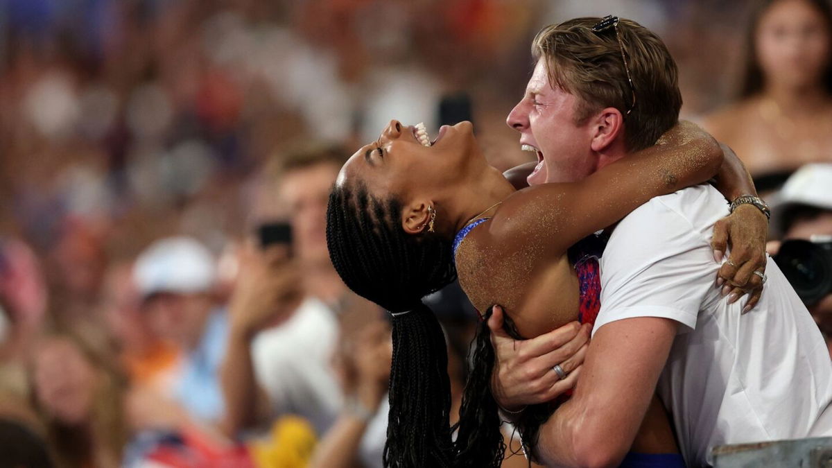 Tara Davis-Woodhall celebrates with her husband