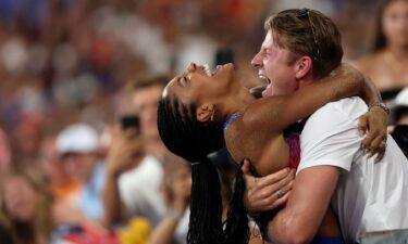 Tara Davis-Woodhall celebrates with her husband