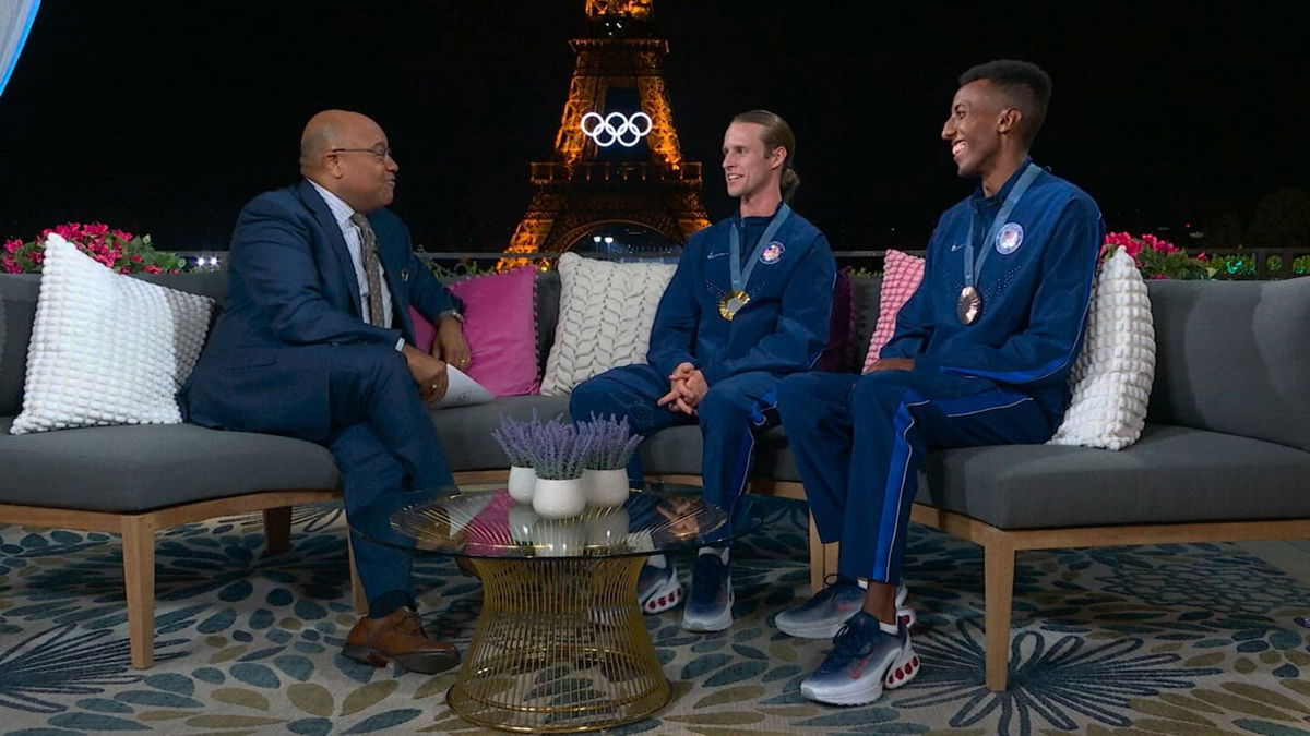 Cole Hocker and Yared Nuguse with Mike Tirico at 2024 Paris Olympic Games