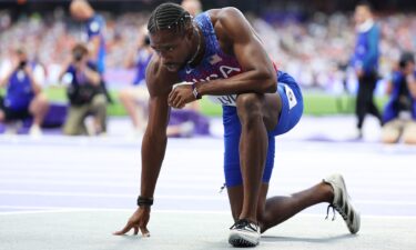 Noah Lyles kneeling on track