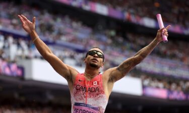 Andre De Grasse celebrates for Canada.