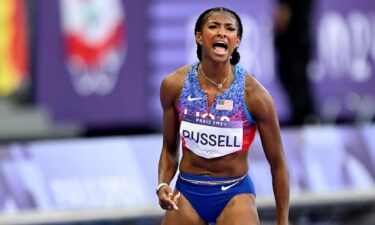 Masai Russell celebrates after 100m hurdles win