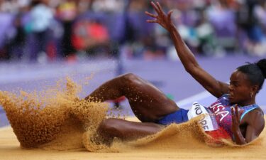 Jasmine Moore landing after long jump