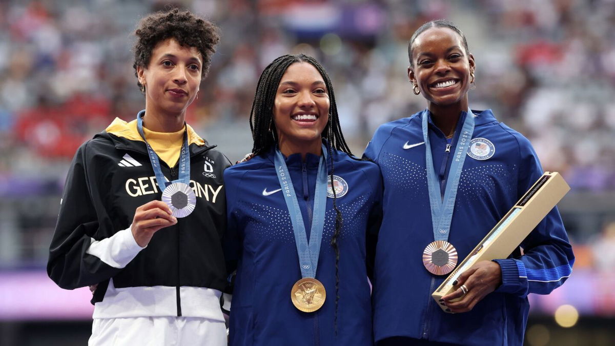 Long jump medalists on the podium