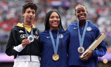 Long jump medalists on the podium