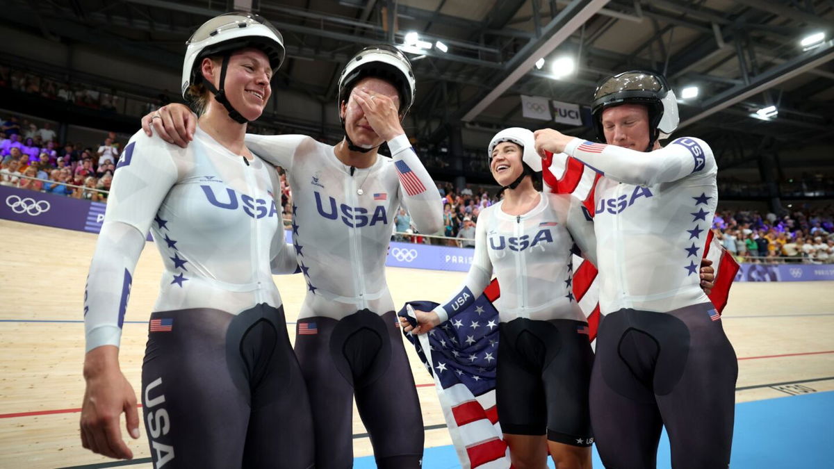 The U.S. women's team pursuit squad celebrate gold