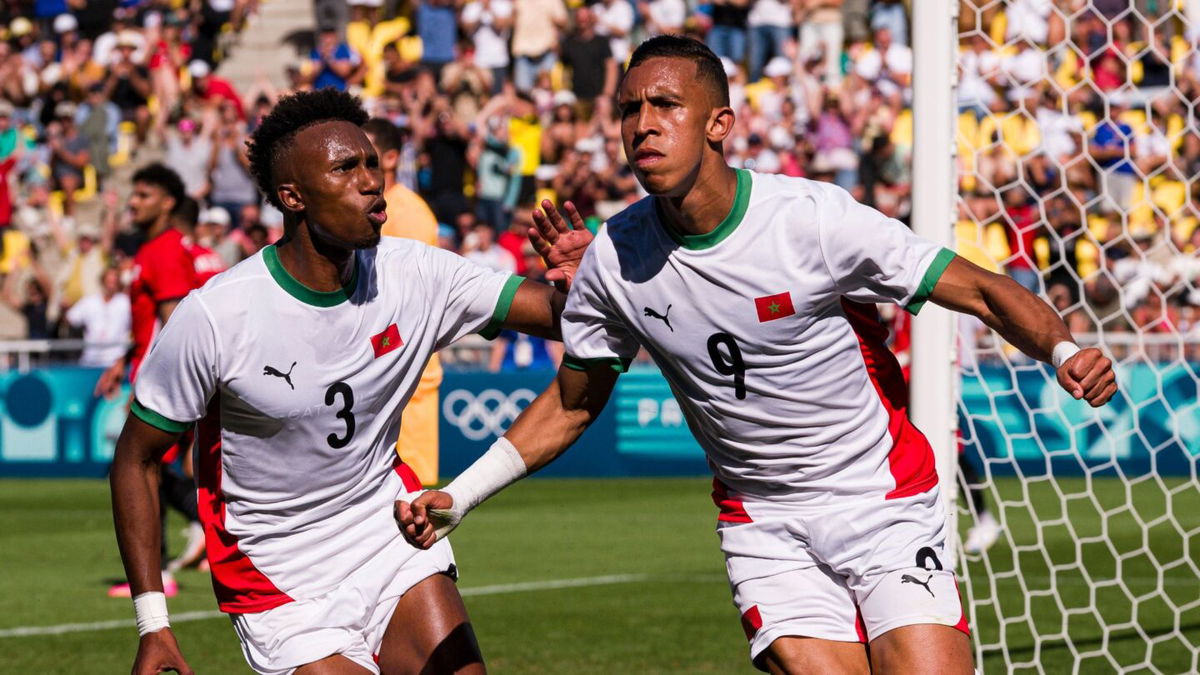 Morocco players celebrate after scoring a goal.