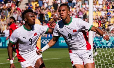 Morocco players celebrate after scoring a goal.