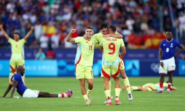 Spain players celebrate after winning a match.