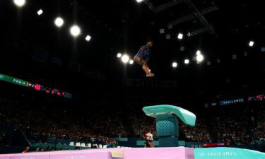 Simone Biles flips through the air