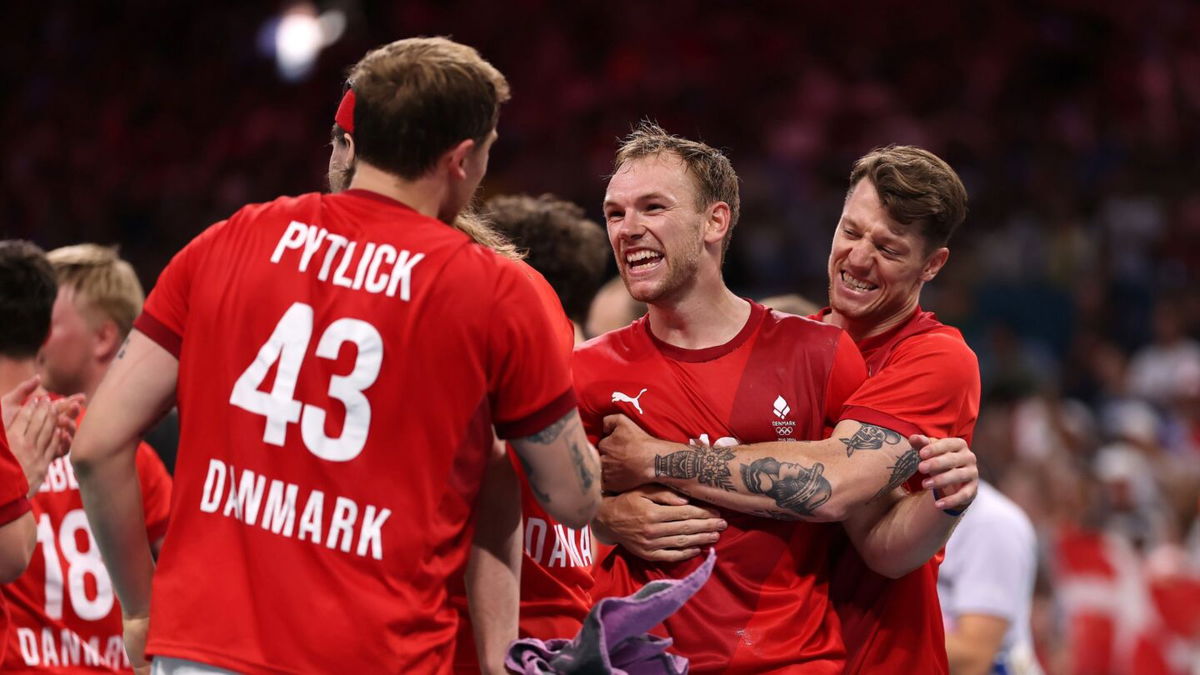 Denmark players celebrate after winning a match.