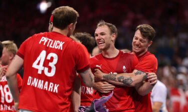 Denmark players celebrate after winning a match.