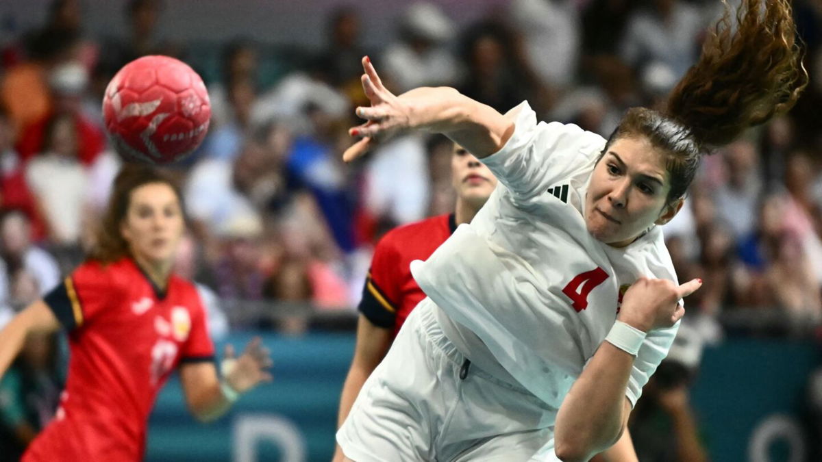 Hungary handball players shoots the ball.