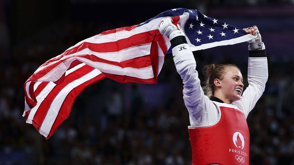 Kristina Teachout with American flag at 2024 Paris Olympic Games