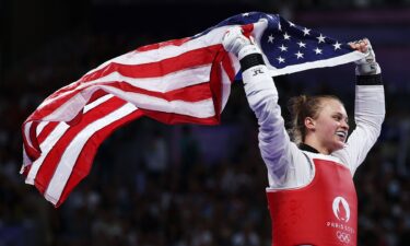 Kristina Teachout with American flag at 2024 Paris Olympic Games